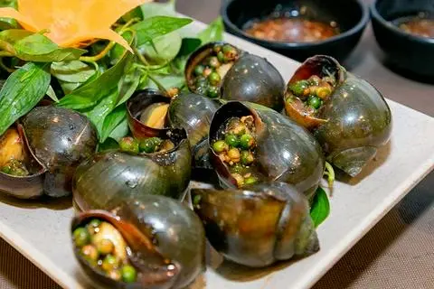 Hình ảnh Ốc bươu nướng tiêu xanh