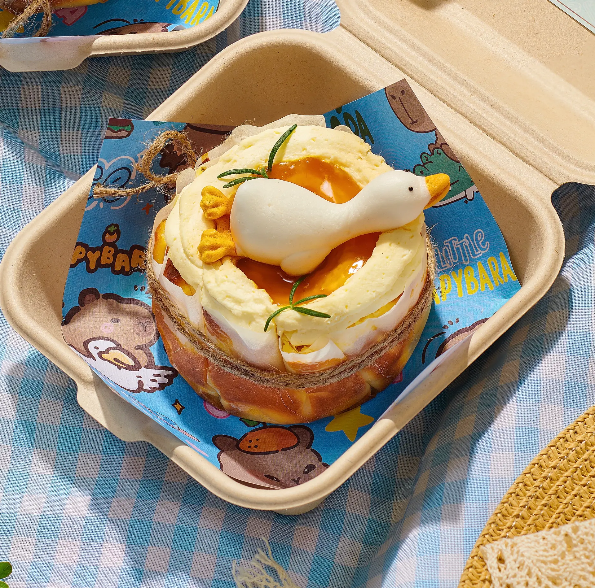 Hình ảnh Bento Cheesecake 10cm Vịt Lười (hộp bã mía)