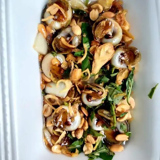 Hình ảnh Ốc mỡ xào me