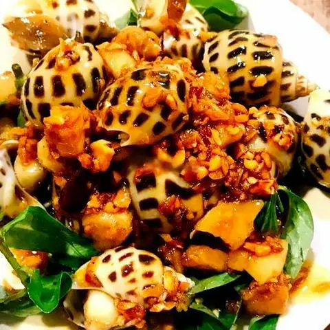 Hình ảnh Ốc hương xào bơ tỏi
