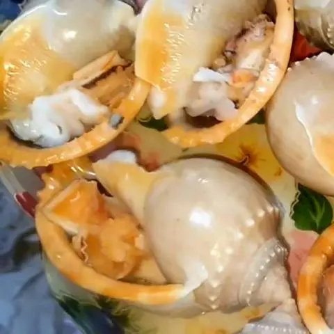 Hình ảnh Ốc tỏi nướng mọi