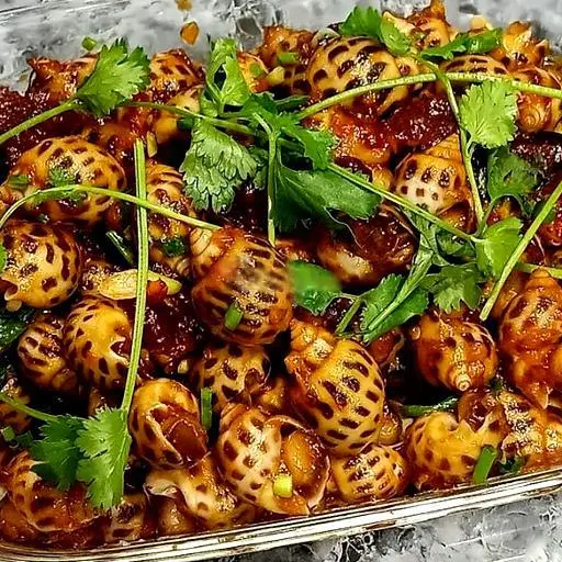 Hình ảnh Ốc hương xào me