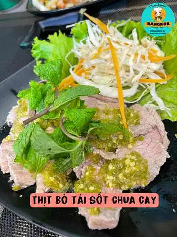Hình ảnh Thịt bò tái sốt chua cay