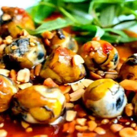 Hình ảnh Vịt lộn xào bơ tỏi 2 quả