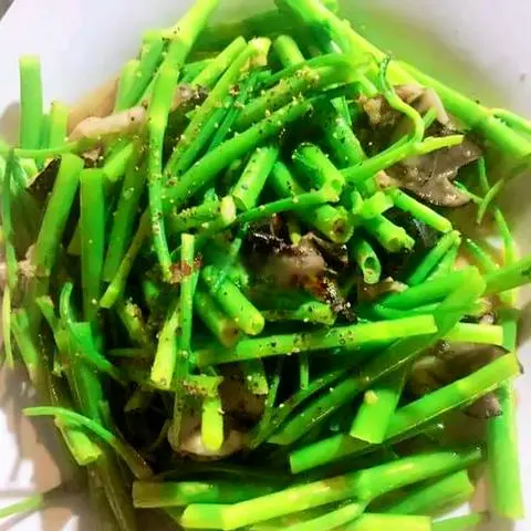 Hình ảnh Ốc giác xào rau muống