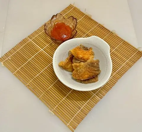 Hình ảnh SNACK DA CÁ HỒI