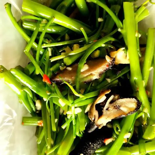 Hình ảnh Ốc giác xào rau muống