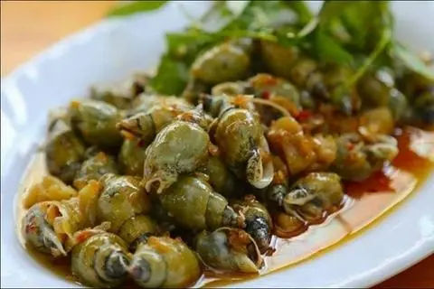 Hình ảnh ốc  cà na xào me