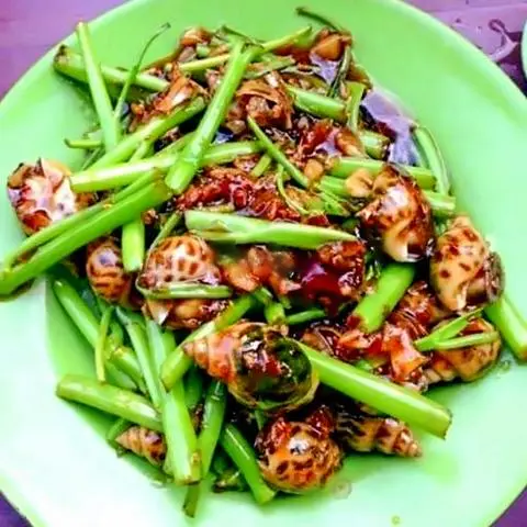 Hình ảnh Ốc hương xào rau muống