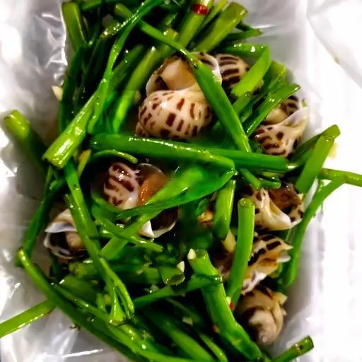 Hình ảnh Ốc hương xào rau muống
