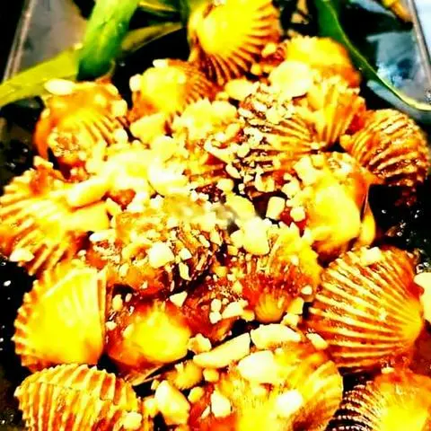 Hình ảnh Sò huyết xào me