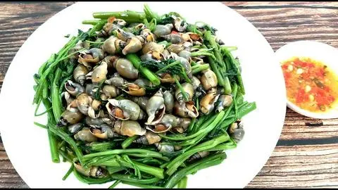 Hình ảnh ốc cà na xào rau muống 