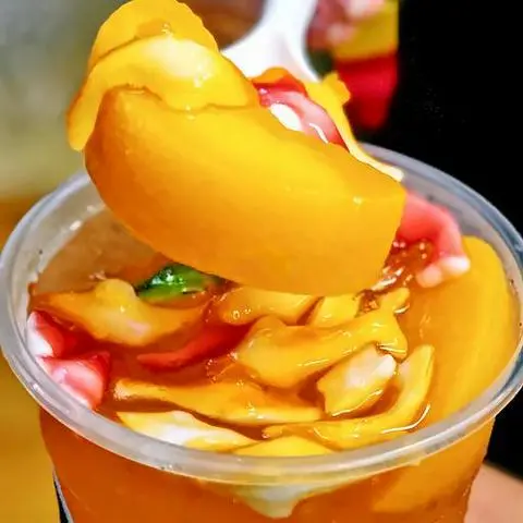 Hình ảnh Trà kiwi dằm dưa lưới
