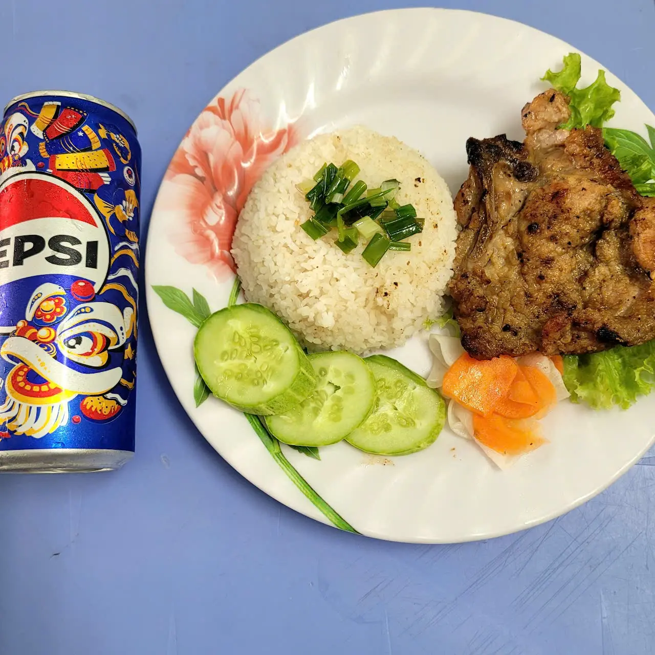 Hình ảnh cơm tấm sườn + 1 chai Pepsi 