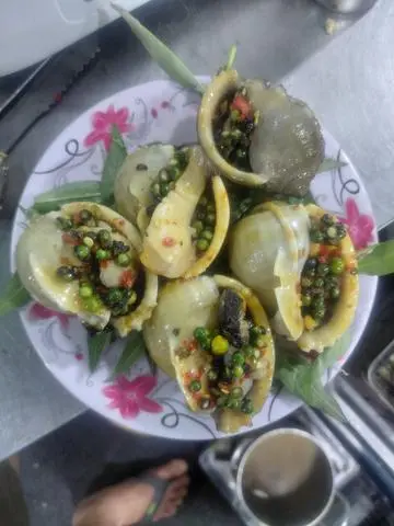 Hình ảnh Ốc Tỏi Nướng Tiêu Xanh 