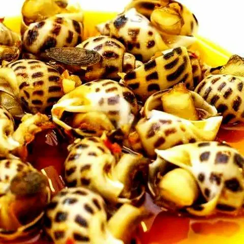 Hình ảnh Ốc Hương Xào Bơ Cay