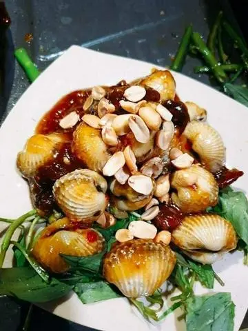 Hình ảnh sò huyết rang me