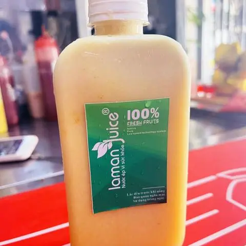 Hình ảnh ép xoài cam táo chai 