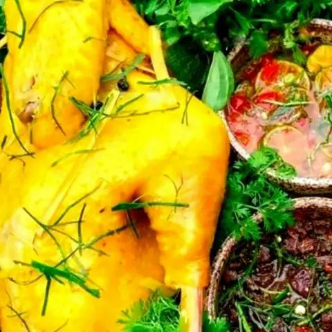 Hình ảnh Gà ủ muối hoa tiêu nửa con không chặt - kèm 2 hũ sốt chấm muối hoa tiêu