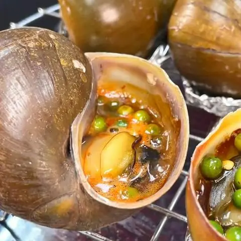 Hình ảnh Ốc bươu nướng mỡ hành