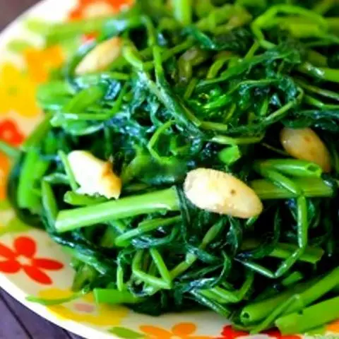 Hình ảnh Ốc tỏi xào rau muống