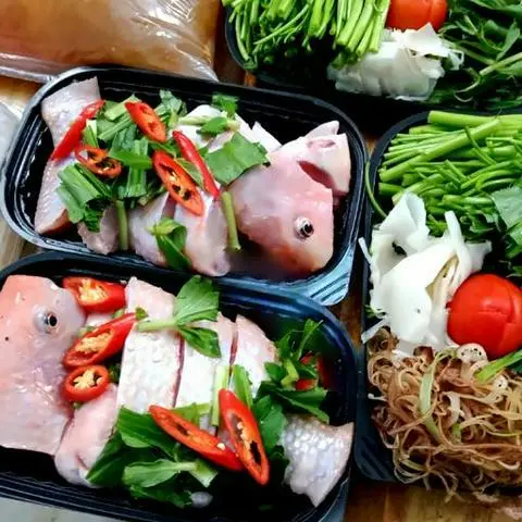 Hình ảnh Lẩu cá điêu hồng măng chua