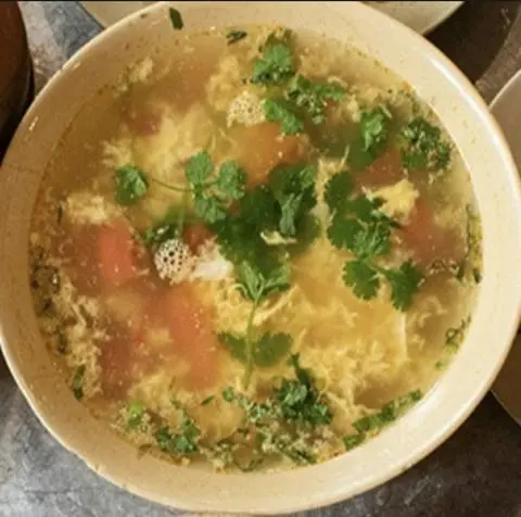 Hình ảnh Canh cà chua trứng đậu mơ non