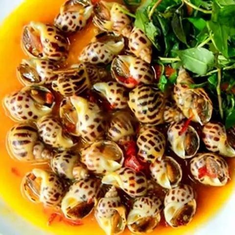 Hình ảnh Ốc hương xào bơ tỏi