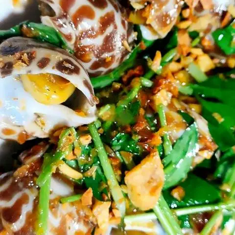 Hình ảnh Ốc hương quế xào bơ tỏi