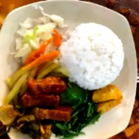 Hình ảnh Cơm heo quay chay kho cải chua