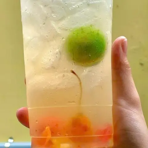 Hình ảnh Trà hạnh phúc. xí muội ( trà tắc xí muội ( topping ngũ vị)