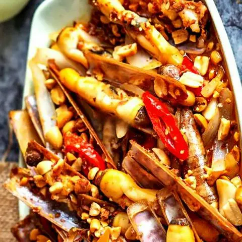 Hình ảnh Ốc móng tay xào me
