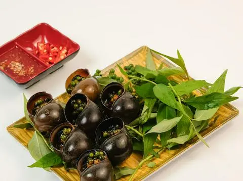 Hình ảnh Ốc bươu nướng tiêu xanh