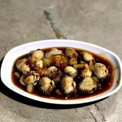 Hình ảnh Sò huyết xào me
