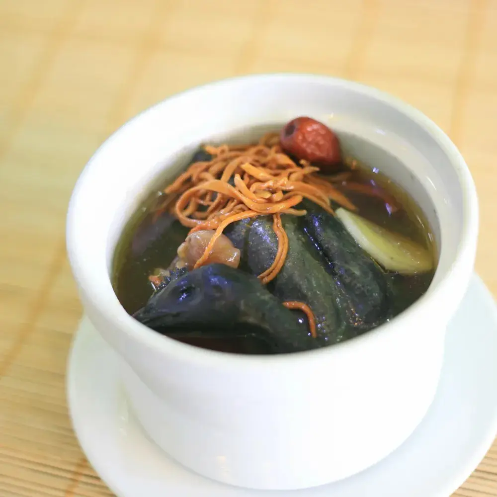 Hình ảnh Canh gà ác tiềm hoa trùng thảo