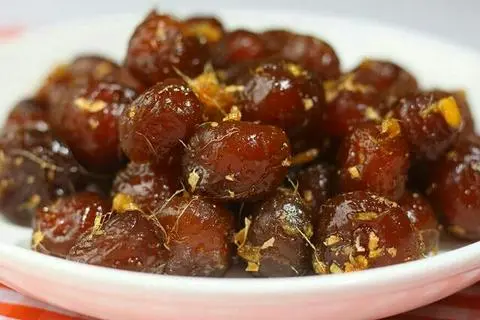 Hình ảnh Ô mai mơ tươi xào gừng