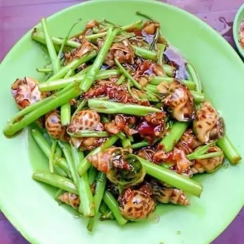 Hình ảnh Ốc hương xào rau muống