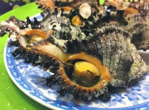 Hình ảnh Ốc gai đen nhỏ nướng mọi