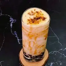 Hình ảnh Sữa tươi trân châu đường đen kem trứng nướng
