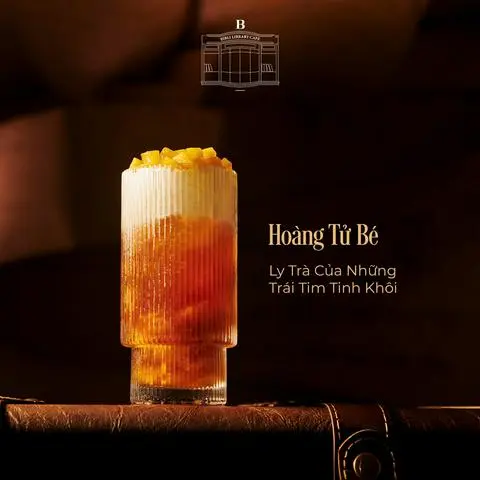 Hình ảnh Trà đen kem béo sốt xoài