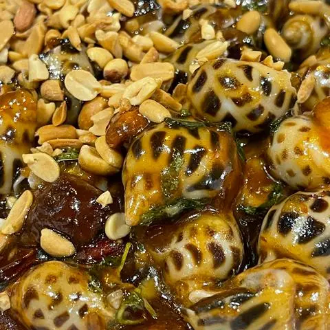 Hình ảnh Ốc hương xào me