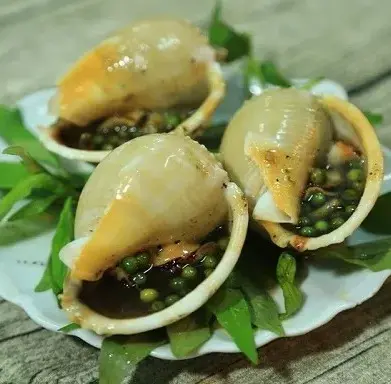 Hình ảnh Ốc tỏi nướng tiêu xanh